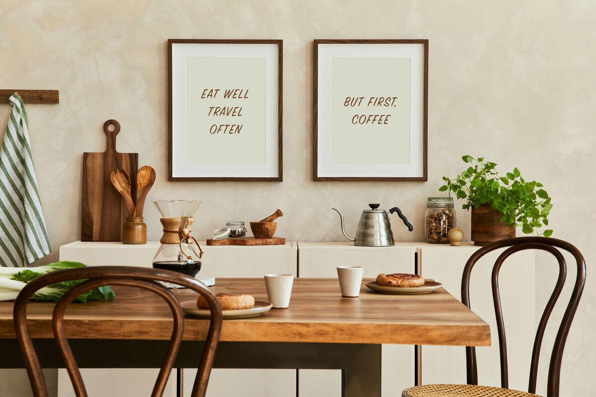 Two Rich Mahogany frames with coffee-themed prints above a kitchen table